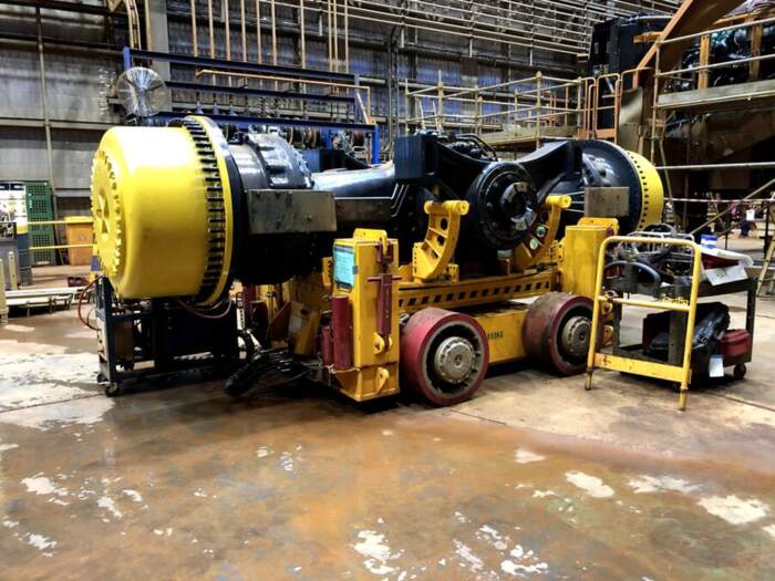 Heavy drive assembly on stands in a workshop