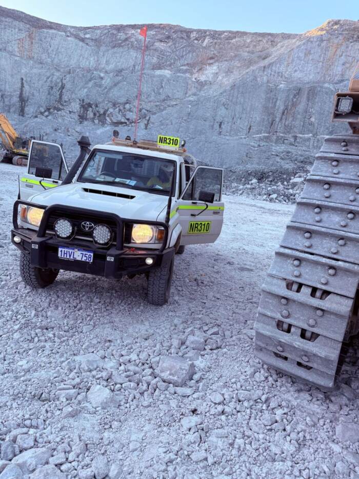 Mine-spec four wheel drive utility at a quarry face